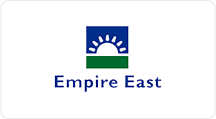 empire east's company logo with a rising sun in the middle